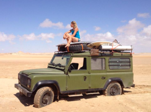 sitting on a jeep in the desert of dakhla and watching around